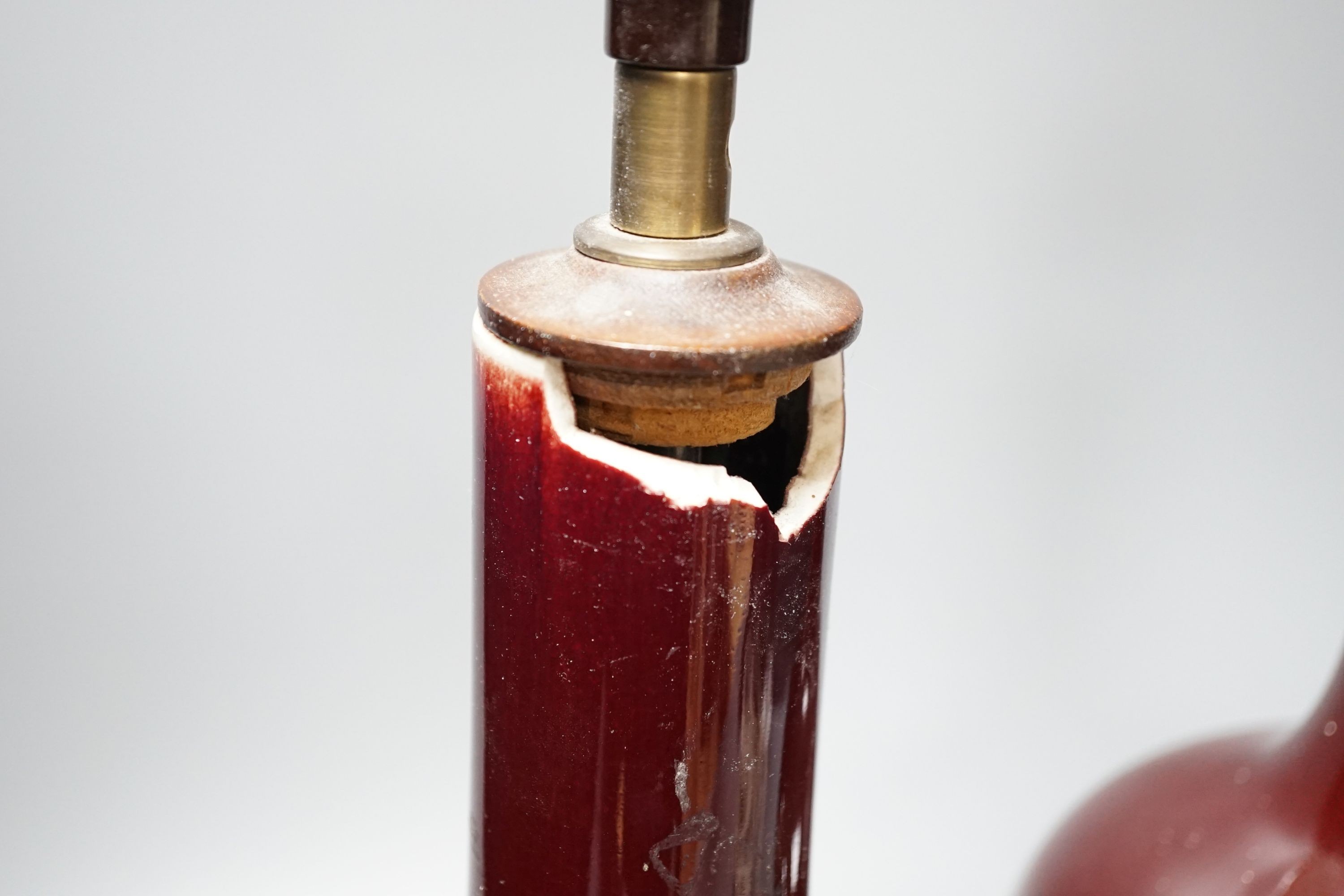 A pair of Chinese sang de boeuf glazed vases, converted to table lamps (a.f.)
